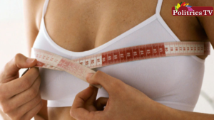 What are the signs of breast development in women?